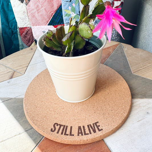 STILL ALIVE // Funny Cork Plant Mat – Millennial & Gen Z Humor | Surface Protector | Houseplant Accessory